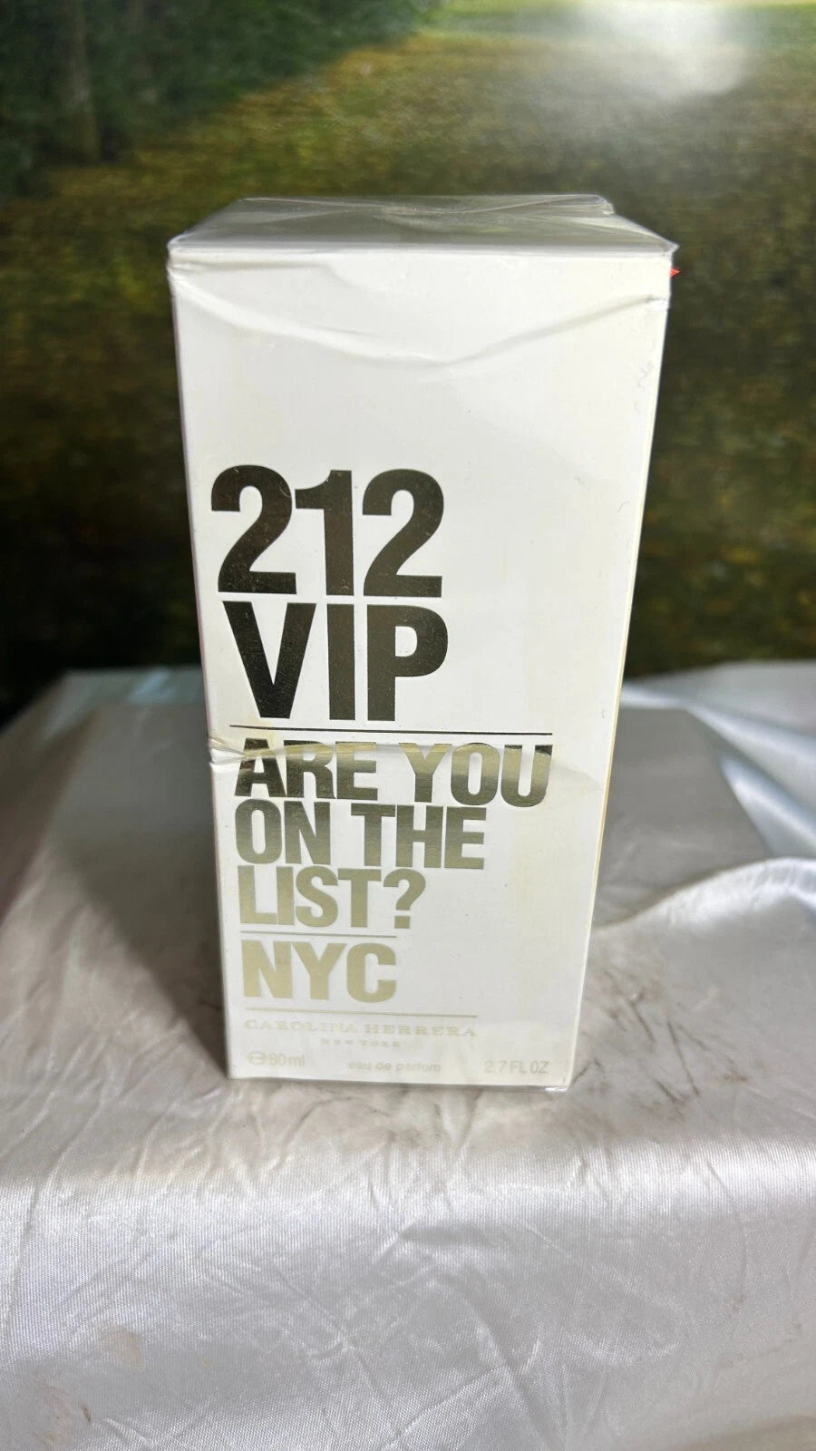 212 VIP perfume box on a white surface with a blurred background