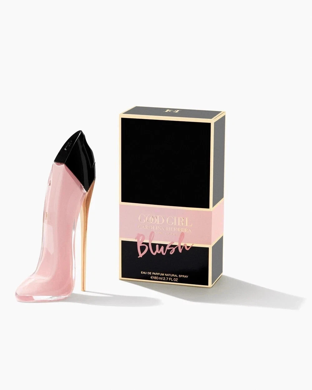 Pink perfume bottle with 'Blush' packaging on a white background