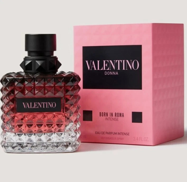 Valentino perfume bottle and packaging on a light gray background