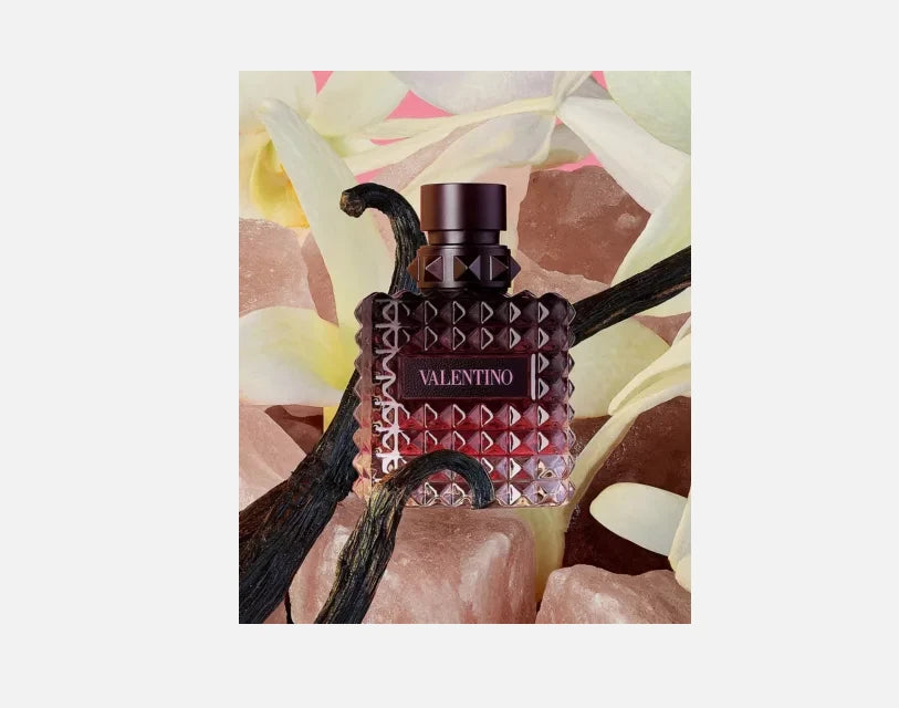 Valentino perfume bottle with abstract floral background